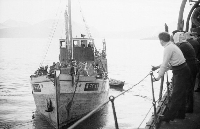 A boat load of Royal Engineers leaves HMS CAIRO on board a Motor Fishing Vessel to land at Narvik in Norway, June 1940. N326.jpg